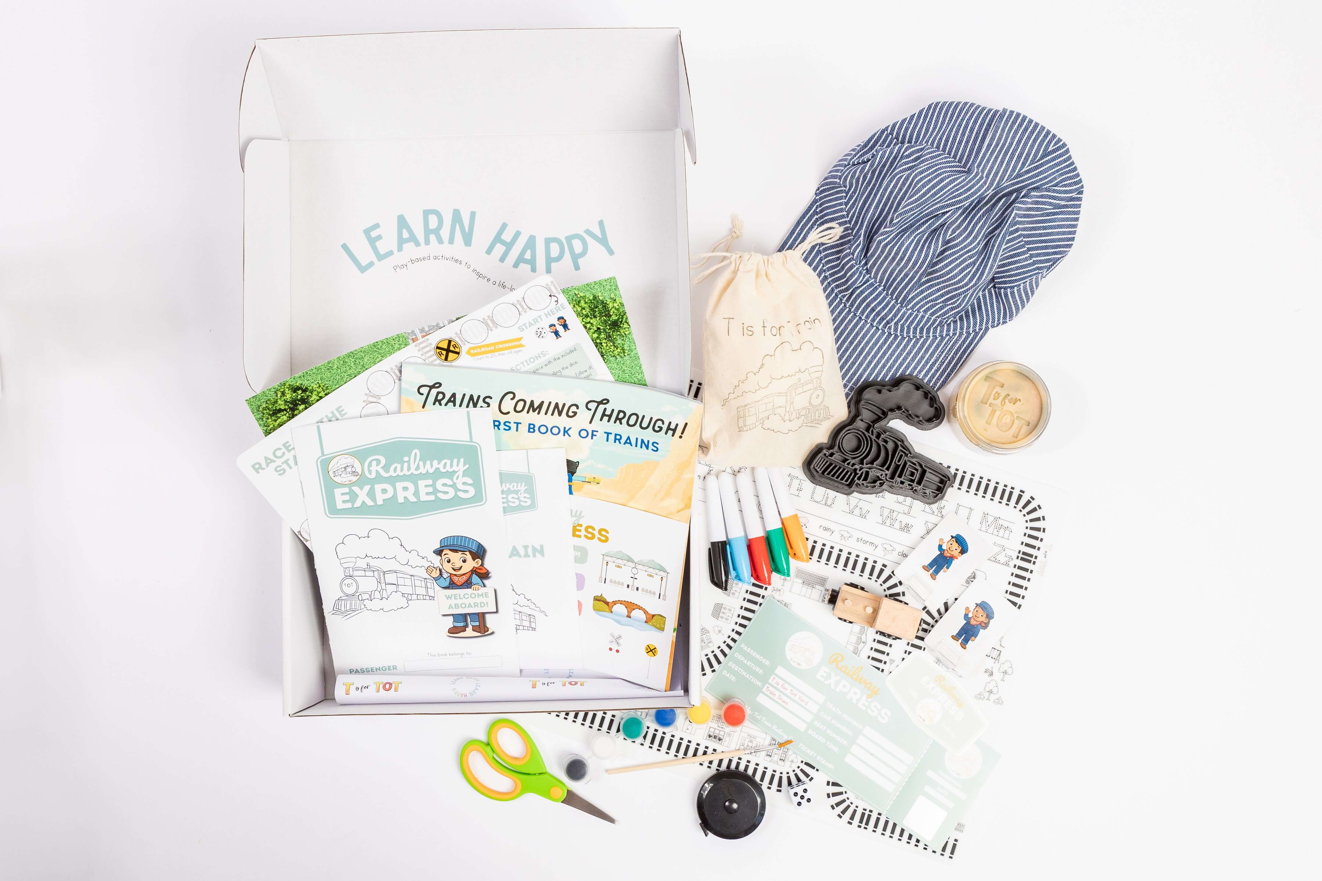 T-Is-For-Train Kit contents including tracks, trains, cards, and learning tools for preschoolers